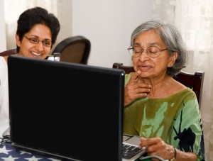 elderly woman at laptop with daughter